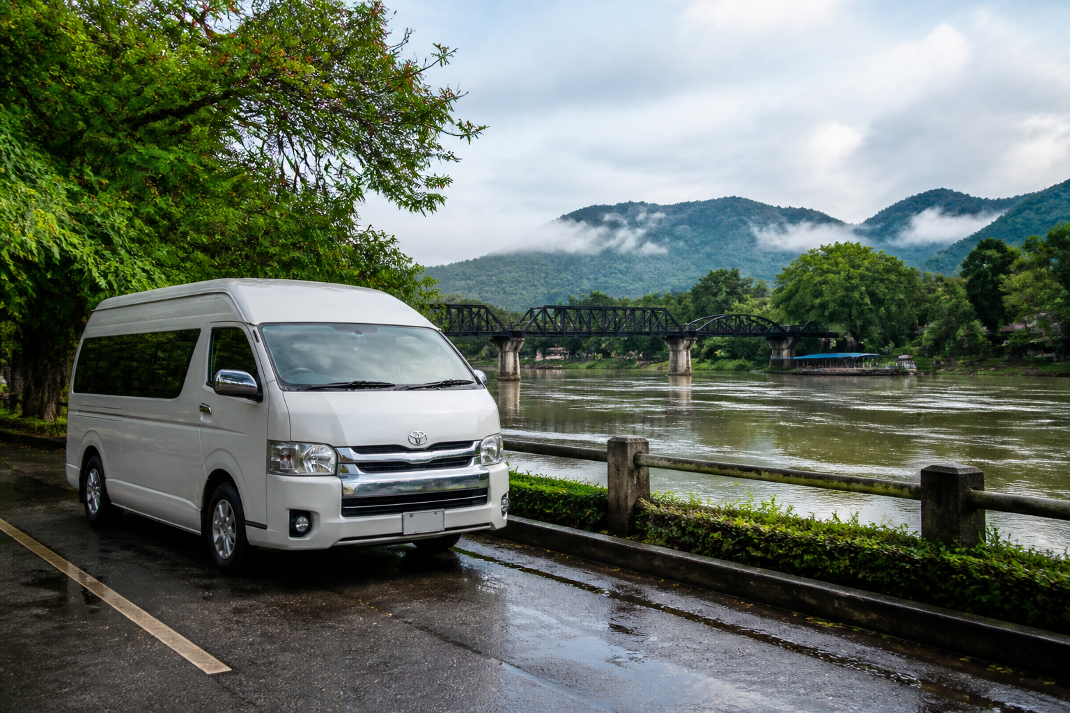Private van waiting near a calm River Kwai viewpoint in Kanchanaburi