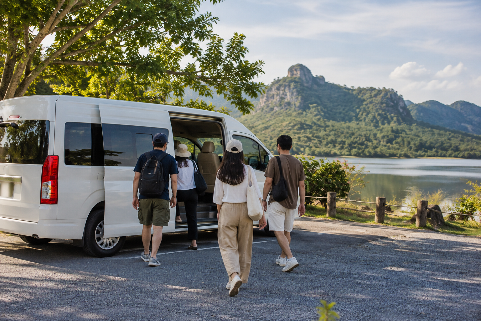 Travelers returning to a private van after a Saraburi countryside pause